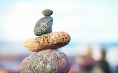 Zen Balancing close up macro stones pebble stack on a sea shore