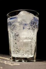 glass full of cool water (tonic) with ice