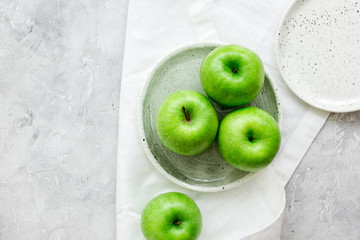 fresh organic green fruits with apples on stone background top view mock-up