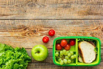 take away with lunchbox and fresh food on wooden background top view space for text