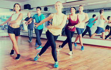 Men and ladies dancing zumba