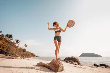 happy summer girl in 50s swimsuit on the beach © zolotareva_elina