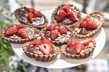 Chocolate tartlets with strawberry fruits