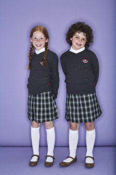 Portrait of two smiling girls wearing school uniform