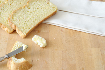 Bread and butter on the kitchen table, top view