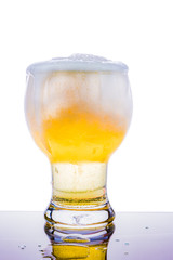 pour yellow beer in glass white background