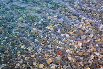 Background of rounded pebbles at sea coast.