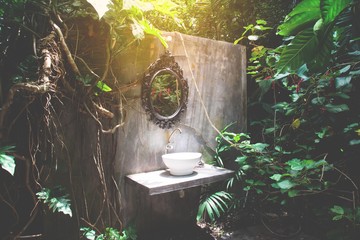 Vintage toilet in cottage country garden or tropical forest