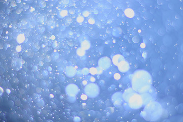 A beautiful and blurry bokeh on a blue background.