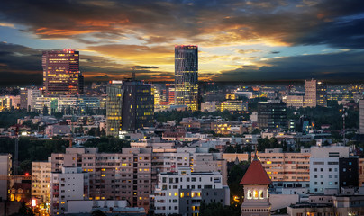 Fototapeta premium Aerial view of the business district in Bucharest, Romania at sunset.