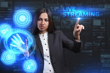 The concept of business, technology, the Internet and the network. A young entrepreneur working on a virtual screen of the future and sees the inscription: Live streaming