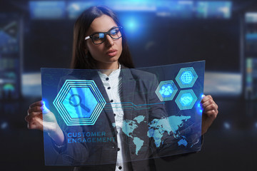 The concept of business, technology, the Internet and the network. A young entrepreneur working on a virtual screen of the future and sees the inscription: Customer engagement
