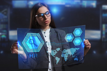 The concept of business, technology, the Internet and the network. A young entrepreneur working on a virtual screen of the future and sees the inscription: HR
