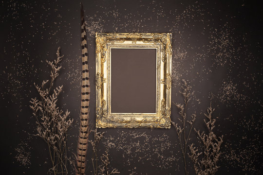 Empty Gold Frame On Black Wall Background