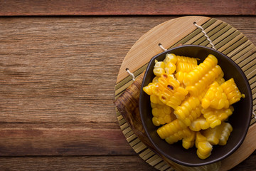 split corn on wood background