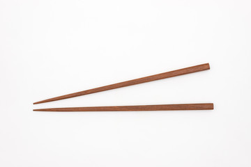 Traditional Japanese wooden chopsticks on white background
