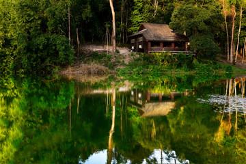 The reflection of the house in water, Krathing Waterfall, Chantaburi, Thailand
