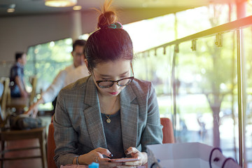 Asian woman with her business at coffee cafe