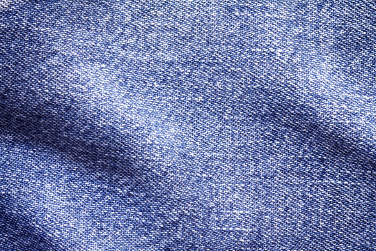 Close up  denim bright  blue jeans surface with wave texture background