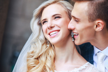 Wedding couple is hugging each other. Beauty bride with groom
