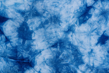 Pattern of blue dye on cotton cloth, Dyed indigo fabric background and textured