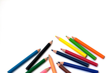 Color pencils on white background, copy space.