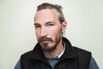 Obraz premium Close-up portrait of young bearded Asian man