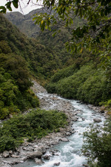 Fototapeta na wymiar river running through a rainforested valley