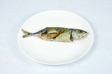 .Fried Short-bodied mackerel in white background, Thai food.