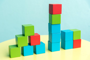 Obraz premium Colorful stack of wood cube building blocks