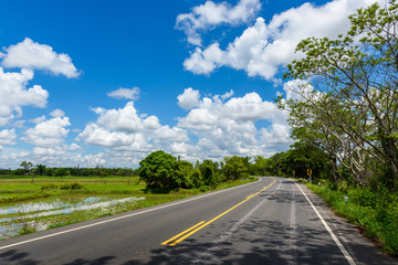 Winding Paved Road with blue sky in the mountain.