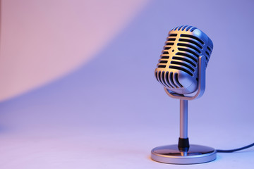 retro microphone isolated on color background