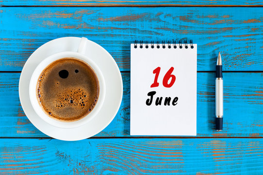 June 16th. Image of june 16 , daily calendar on blue background with morning coffee cup. Summer day, Top view