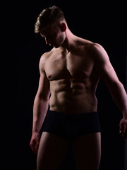 Fototapeta premium strong athletic man, fitness model torso showing six pack abs