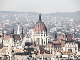 Obraz premium Huge dome of Hungarian Parliament Building - Orszaghaz. Unusual view from St. Stephen's Basilica. Budapes, Hungary.