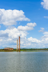 Obraz premium Landscape of Old mill in the reservoir against blue sky