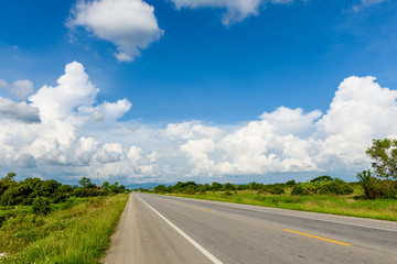 Fototapeta na wymiar country road with blue sky