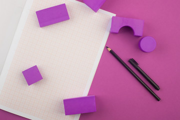 Workspace designer, architect, millimeter paper for drawings, pencil, geometric shapes on purple...