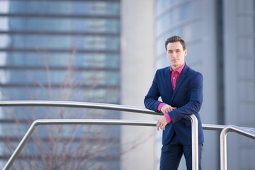 Male portrait with a suit in urban erea