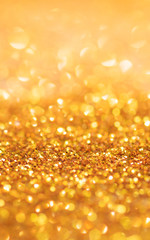 Gold light bokeh texture or glitter lights festive gold background. Christmas abstract template