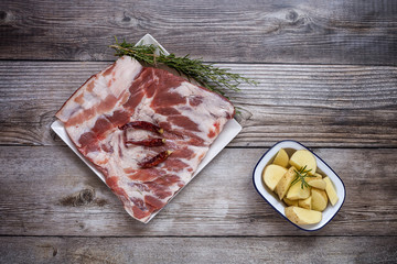Raw pork ribs with herbs and spices ready for cooking