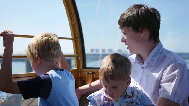 Happy family walk on the Ferris wheel. Panoramic view
