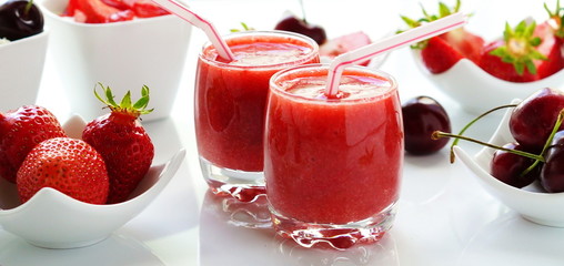 Delicious and healthy desserts strawberries smoothies and yogurt on white background. banner
