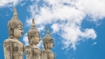 Fototapeta premium Old buddha statue on Clouds and blue sky background.