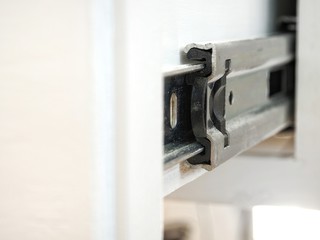 Furniture slide rail or metal drawer track, closeup