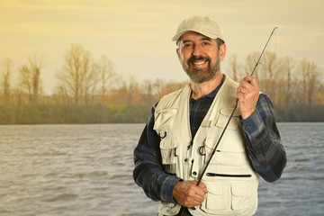 Mature Fisherman by Lake