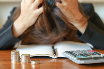 Stressed business woman running out of money - stock and market down.