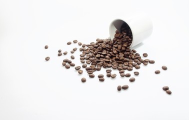 coffee beans and white coffee cup on white background