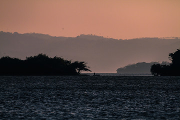 Fishermen on the Lake at Sunset