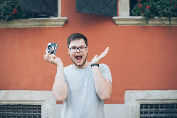 man shooting with old retro camera